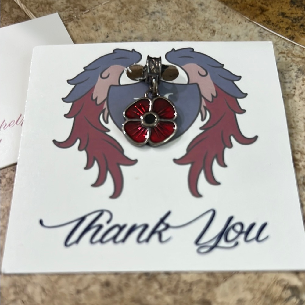 Nomad Collection Red and Silver flower charm